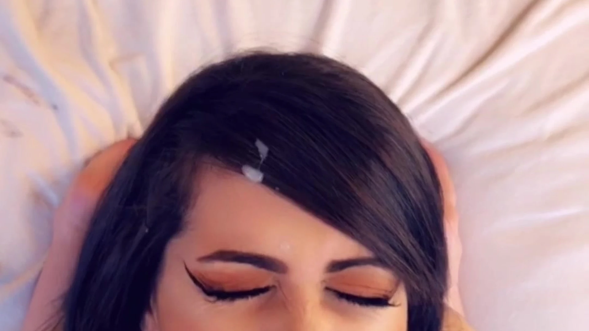brunette giving blowjob to a black cock